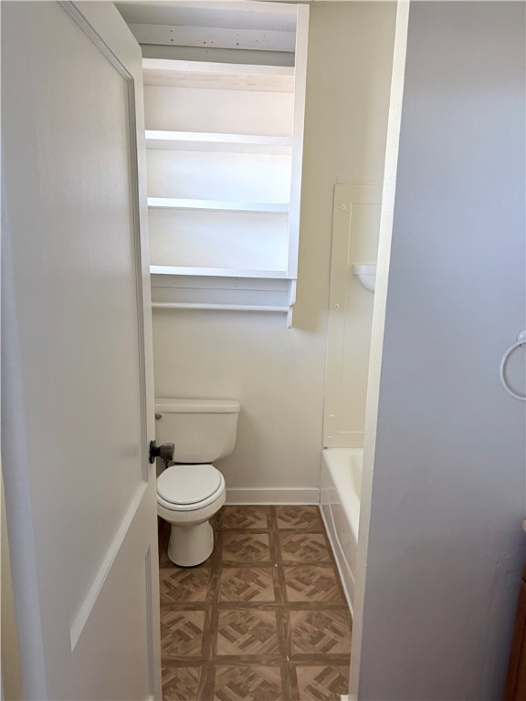 10356 Main Street Somerville, TX 77879 - Photo 16 of 19 a bathroom with a toilet and a sink