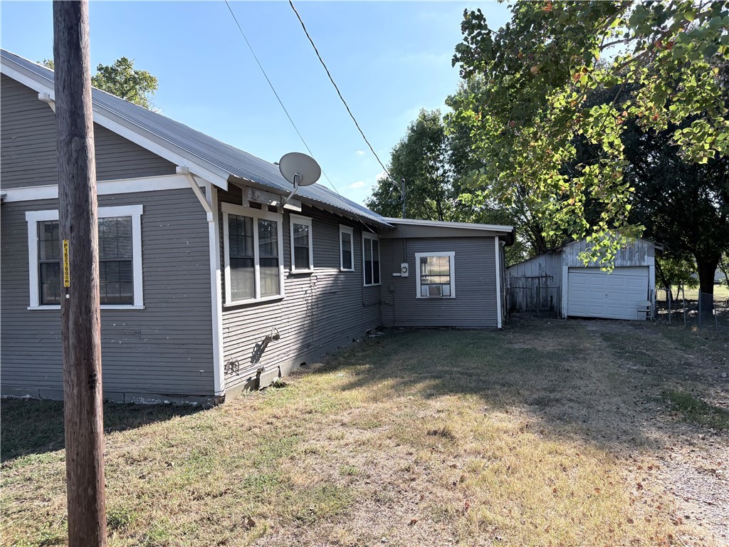 10356 Main Street Somerville, TX 77879 - Photo 2 of 19 a view of a house with a yard and large tree