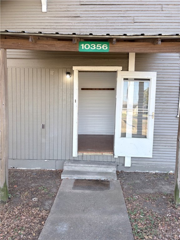 10356 Main Street Somerville, TX 77879 - Photo 3 of 19 a front view of a house with a garage