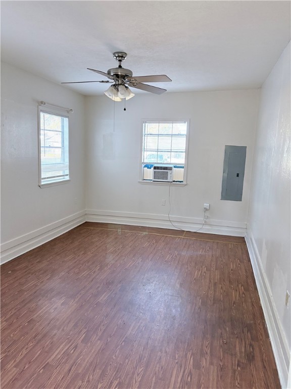 10356 Main Street Somerville, TX 77879 - Photo 8 of 19 an empty room with wooden floor fan and windows