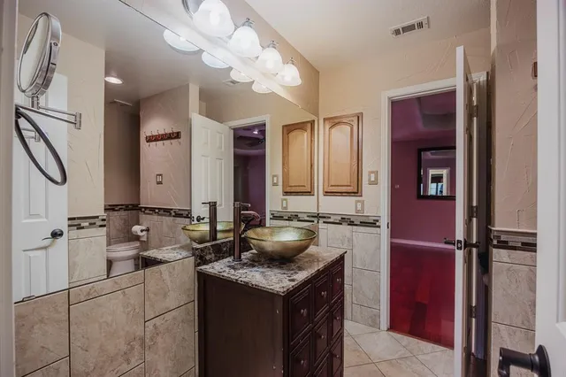 a kitchen with a stove and a refrigerator