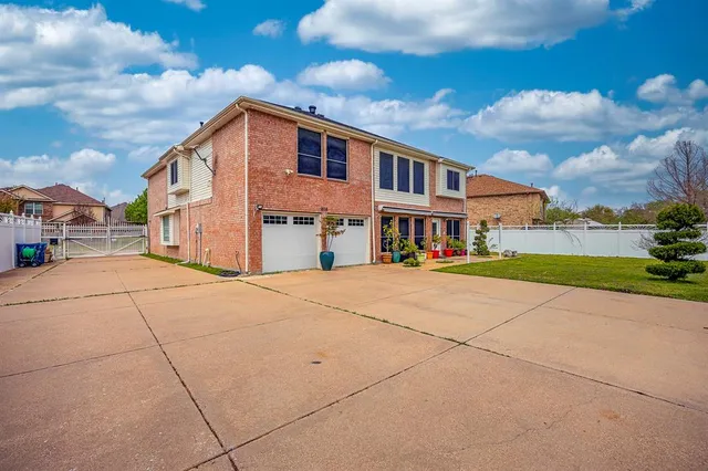 a front view of a building with a yard
