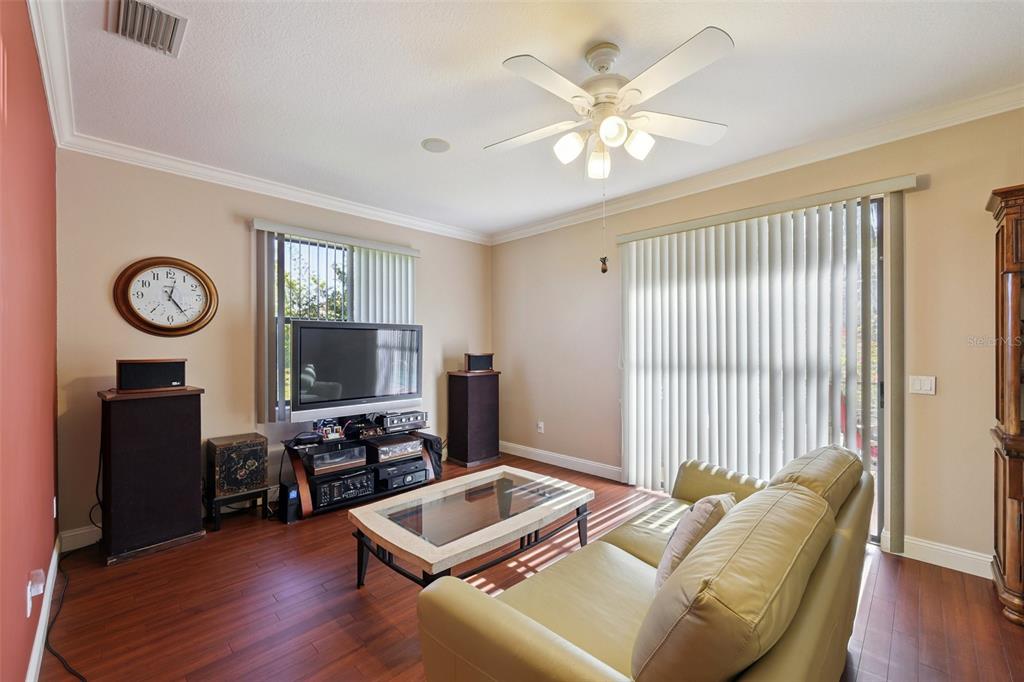 2002 Palm View Road Sarasota, FL 34240 - Photo 13 of 34 a living room with furniture and a flat screen tv