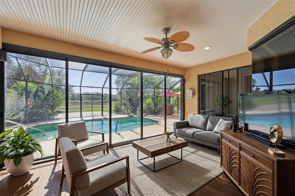 2002 Palm View Road Sarasota, FL 34240 - Photo 25 of 34 a living room with furniture and a floor to ceiling window