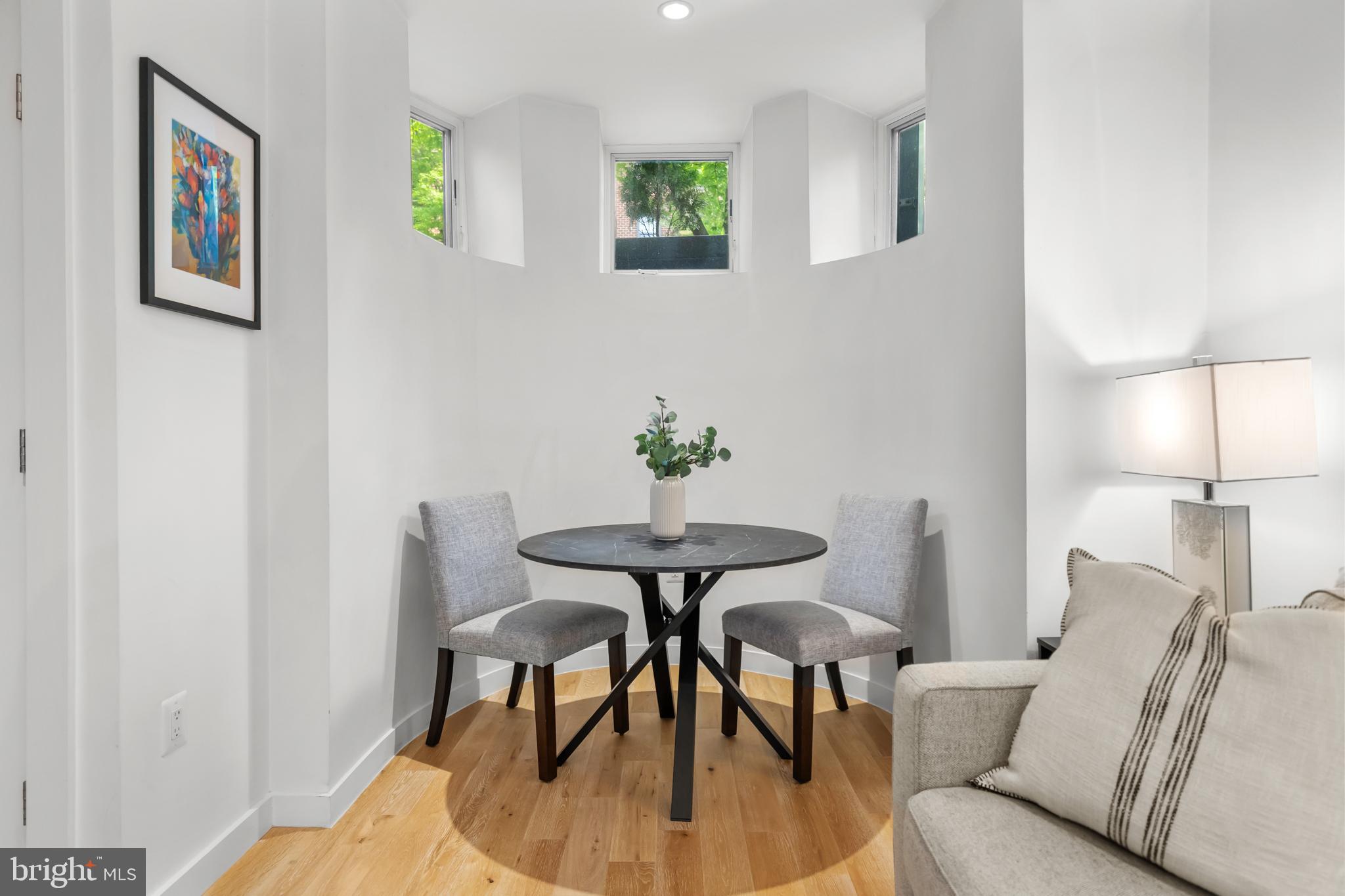 1324 W Street Northwest, Unit 1 Washington, DC 20009 - Photo 14 of 37 a view of a dining room with furniture and wooden floor