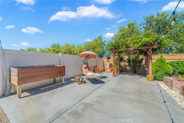 a view of a backyard with sitting area