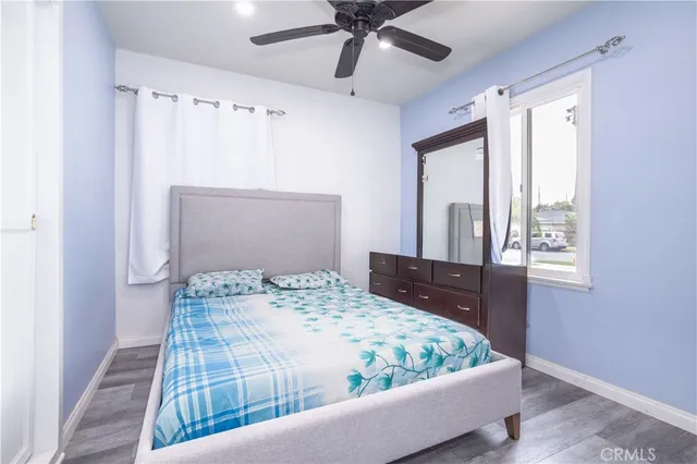 a bedroom with a bed and window