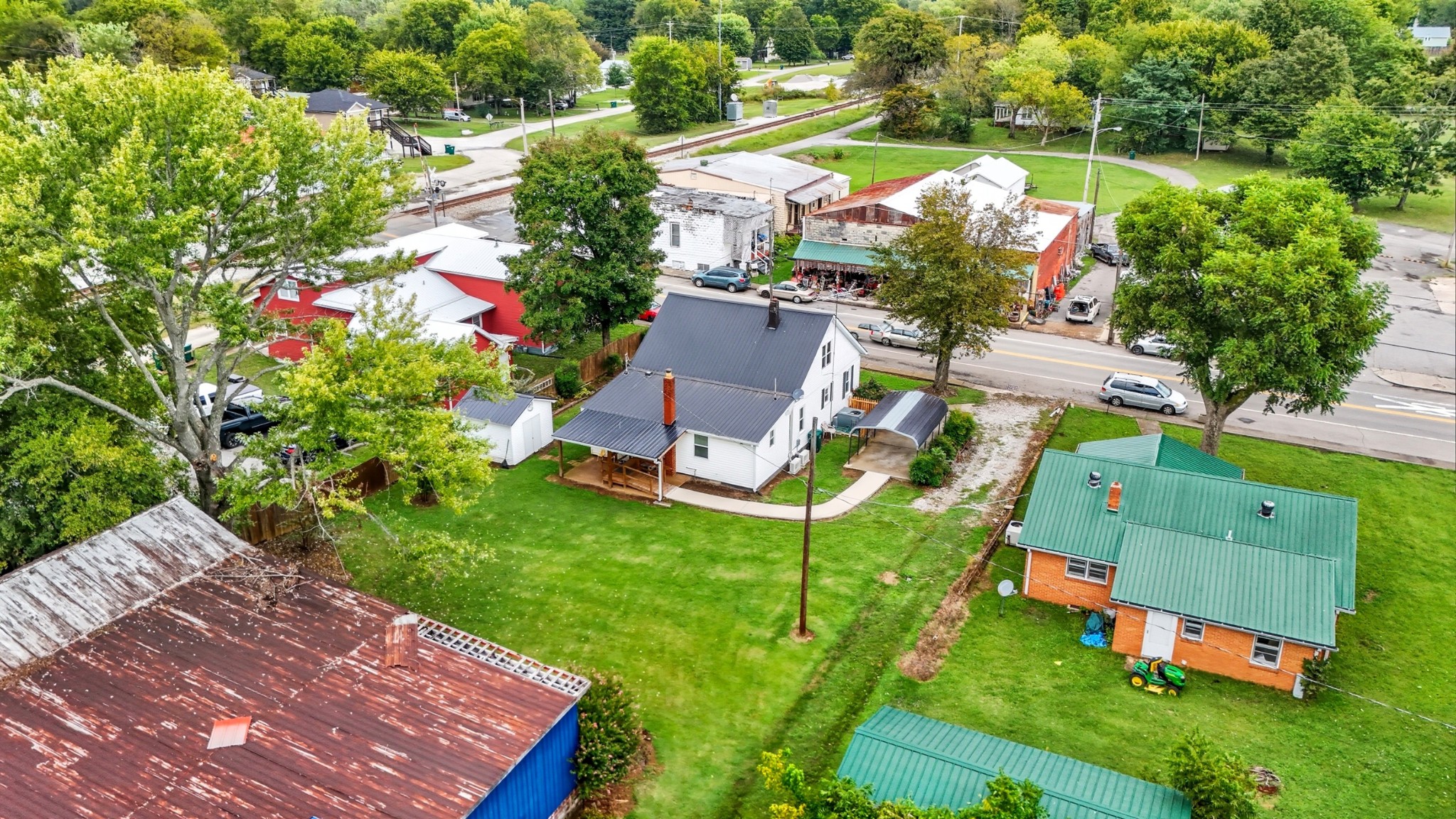 135 Main Street McEwen, TN 37101 - Photo 12 of 62 an aerial view of a house with yard swimming pool and outdoor seating
