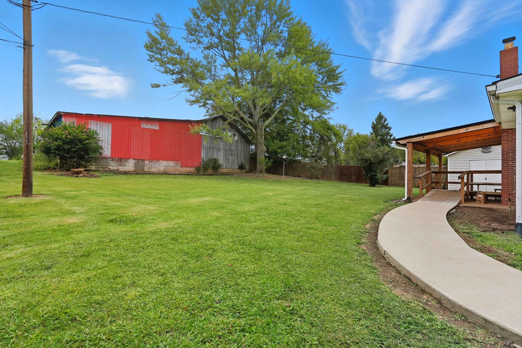 135 Main Street McEwen, TN 37101 - Photo 56 of 62 a view of a backyard with a garden and entertaining space