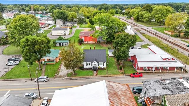 an aerial view of residential houses with outdoor space