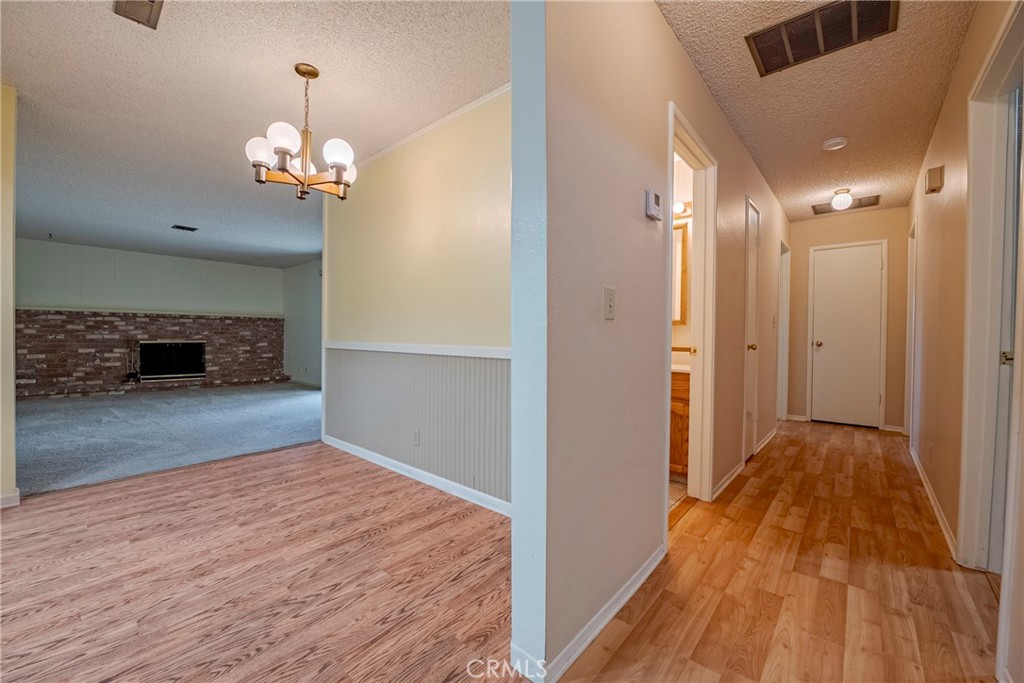 3449 Bautista Court Merced, CA 95348 - Photo 19 of 41 a view of livingroom with hardwood floor and a ceiling fan