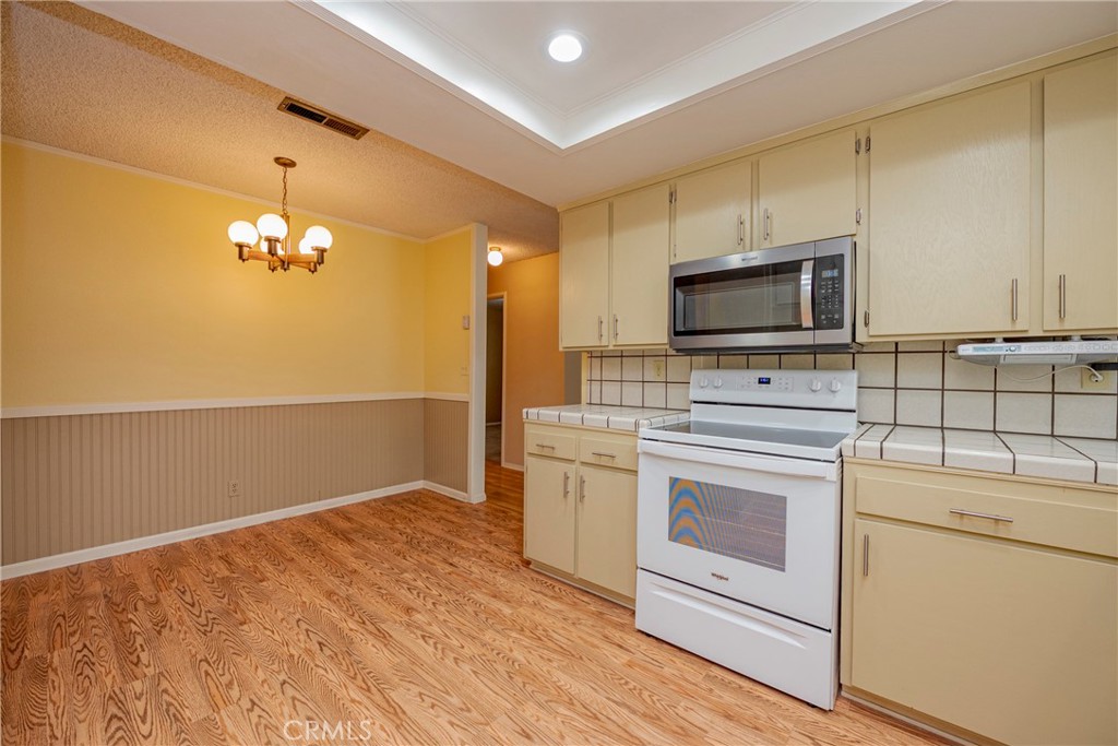 3449 Bautista Court Merced, CA 95348 - Photo 22 of 41 a kitchen with a stove and a microwave