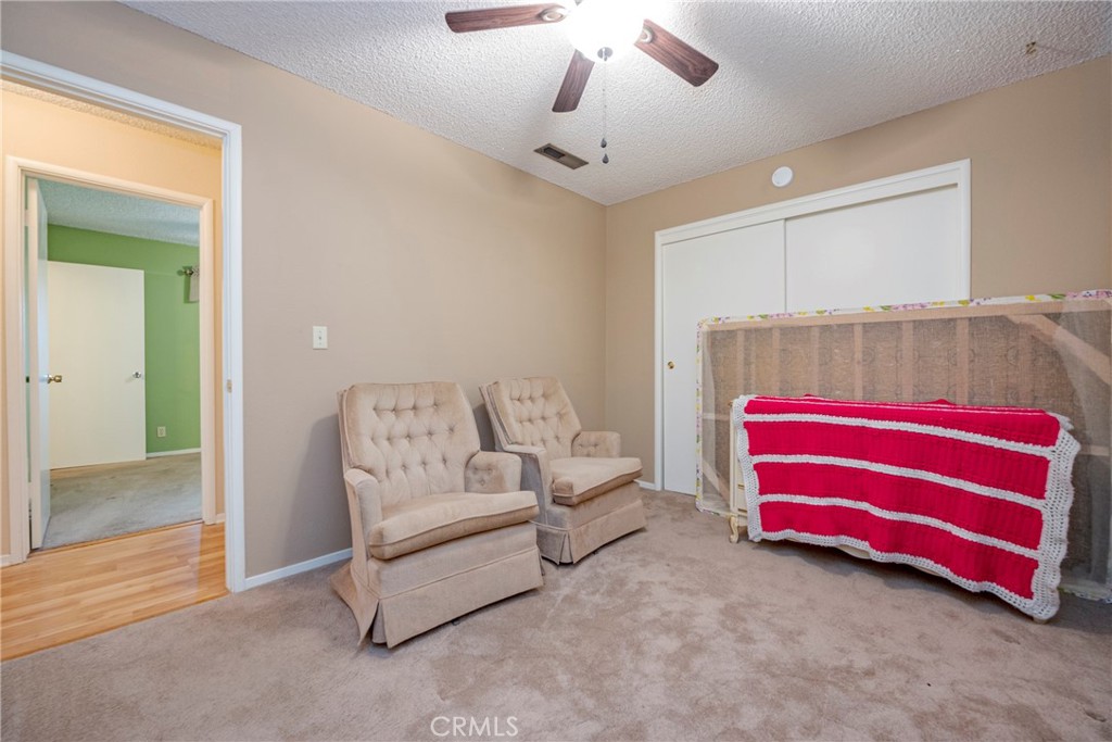3449 Bautista Court Merced, CA 95348 - Photo 33 of 41 a bedroom with furniture and a chandelier