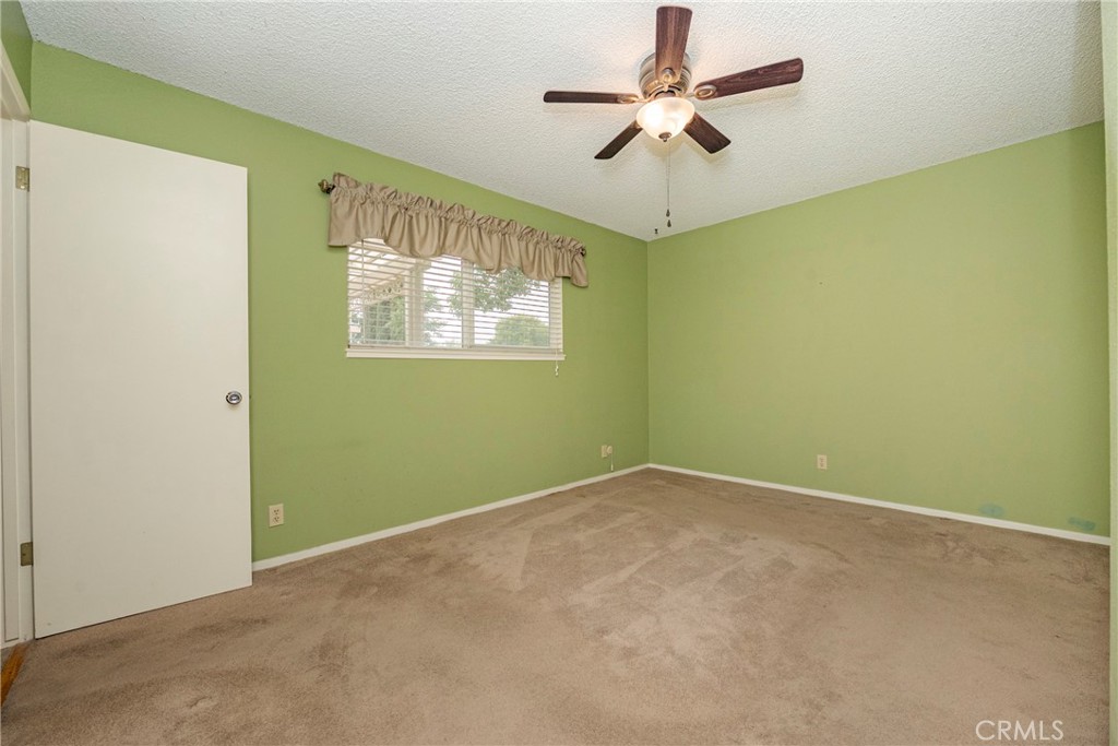 3449 Bautista Court Merced, CA 95348 - Photo 34 of 41 an empty room with a window and a fan