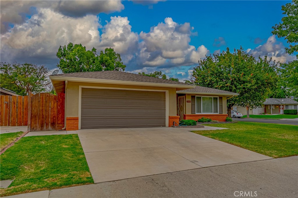 3449 Bautista Court Merced, CA 95348 - Photo 4 of 41 a front view of a house with a yard and garage