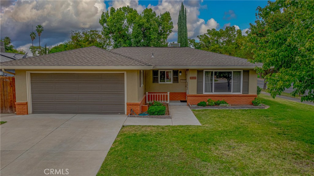 3449 Bautista Court Merced, CA 95348 - Photo 8 of 41 a view of a house with a small yard and large tree