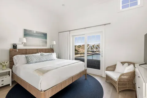 a bedroom with a bed and a couch