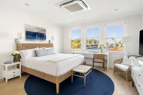 a bedroom with a bed and a couch