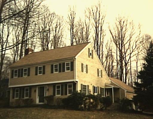 6 Rising Ridge Road Ridgefield, CT 06877 - Photo 1 of 1 a front view of a house with a garden