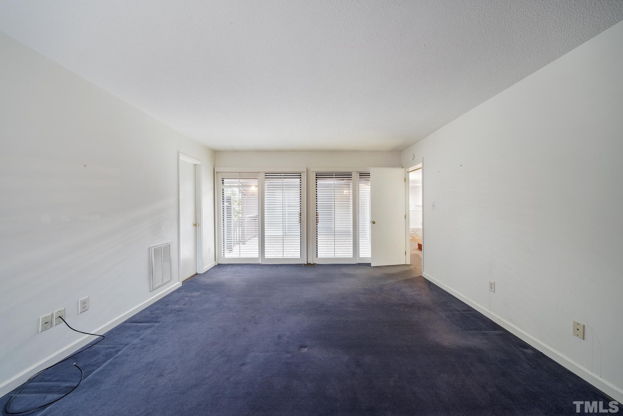 2742 Rue Sans Famille Raleigh, NC 27607 - Photo 12 of 21 a view of an empty room with a window