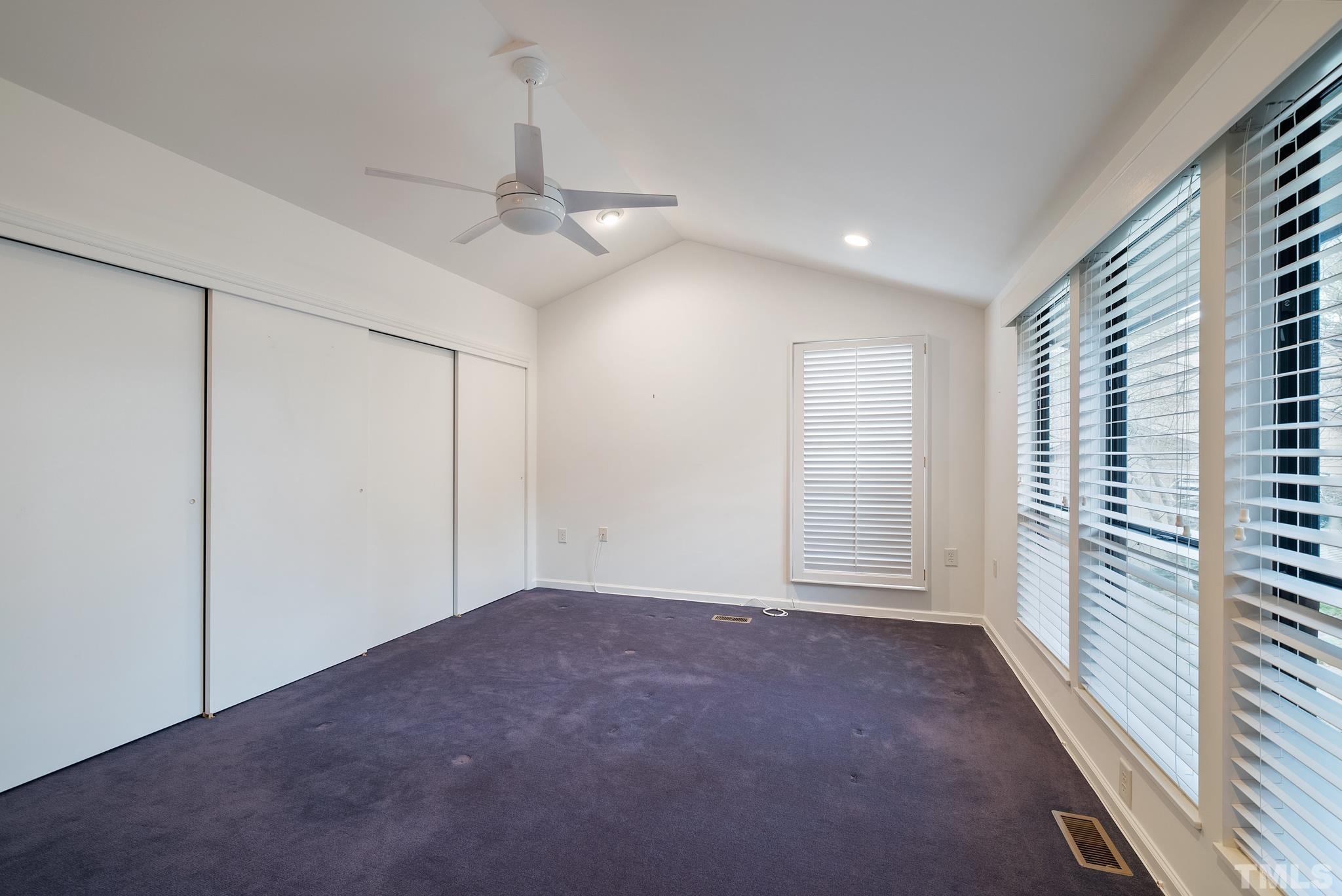 2742 Rue Sans Famille Raleigh, NC 27607 - Photo 14 of 21 an empty room with windows and fan