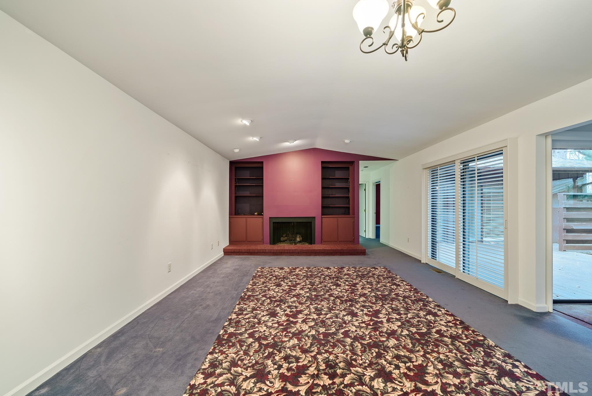 2742 Rue Sans Famille Raleigh, NC 27607 - Photo 3 of 21 a view of a hallway with a chandelier
