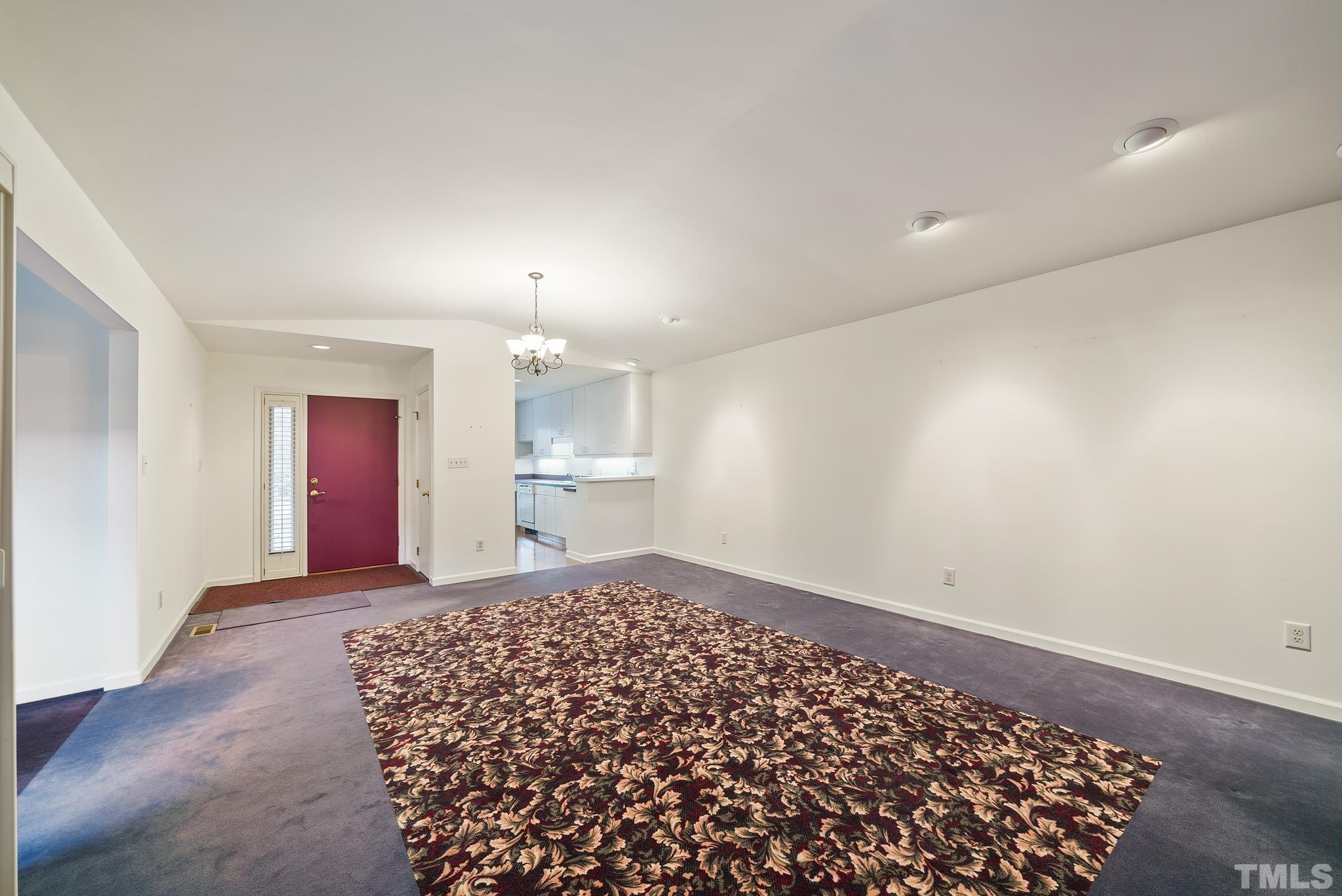 2742 Rue Sans Famille Raleigh, NC 27607 - Photo 4 of 21 a big room with a kitchen