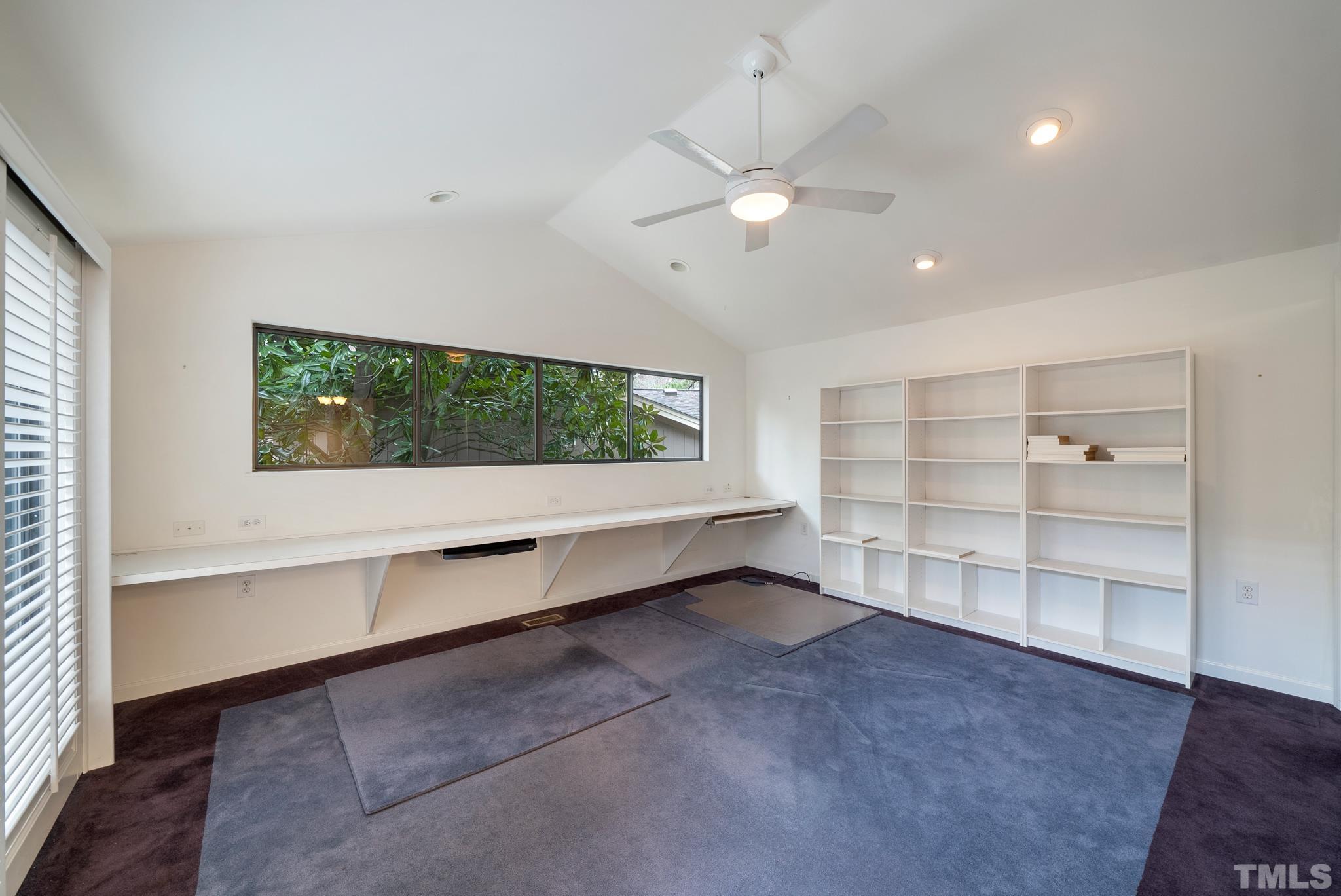 2742 Rue Sans Famille Raleigh, NC 27607 - Photo 9 of 21 wooden floor in an empty room with a window