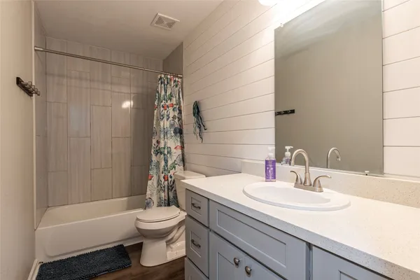 a bedroom with a bed and a table