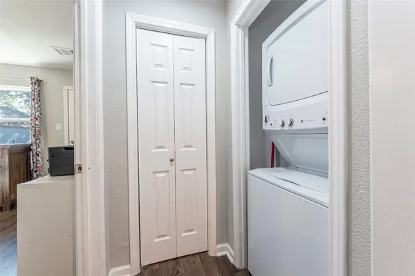 a view of house with backyard and trees