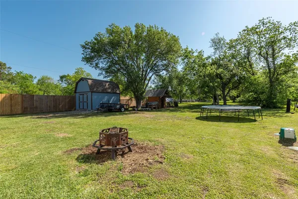 a view of a house with a yard porch and sitting area