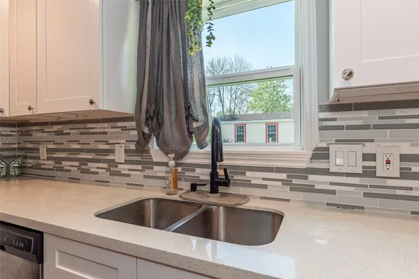 a kitchen with a stove and a microwave
