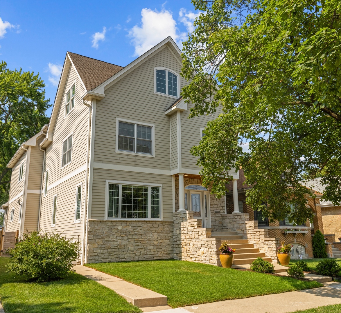 6972 West Imlay Street Chicago, IL 60631 - Photo 1 of 42 a front view of a house with garden