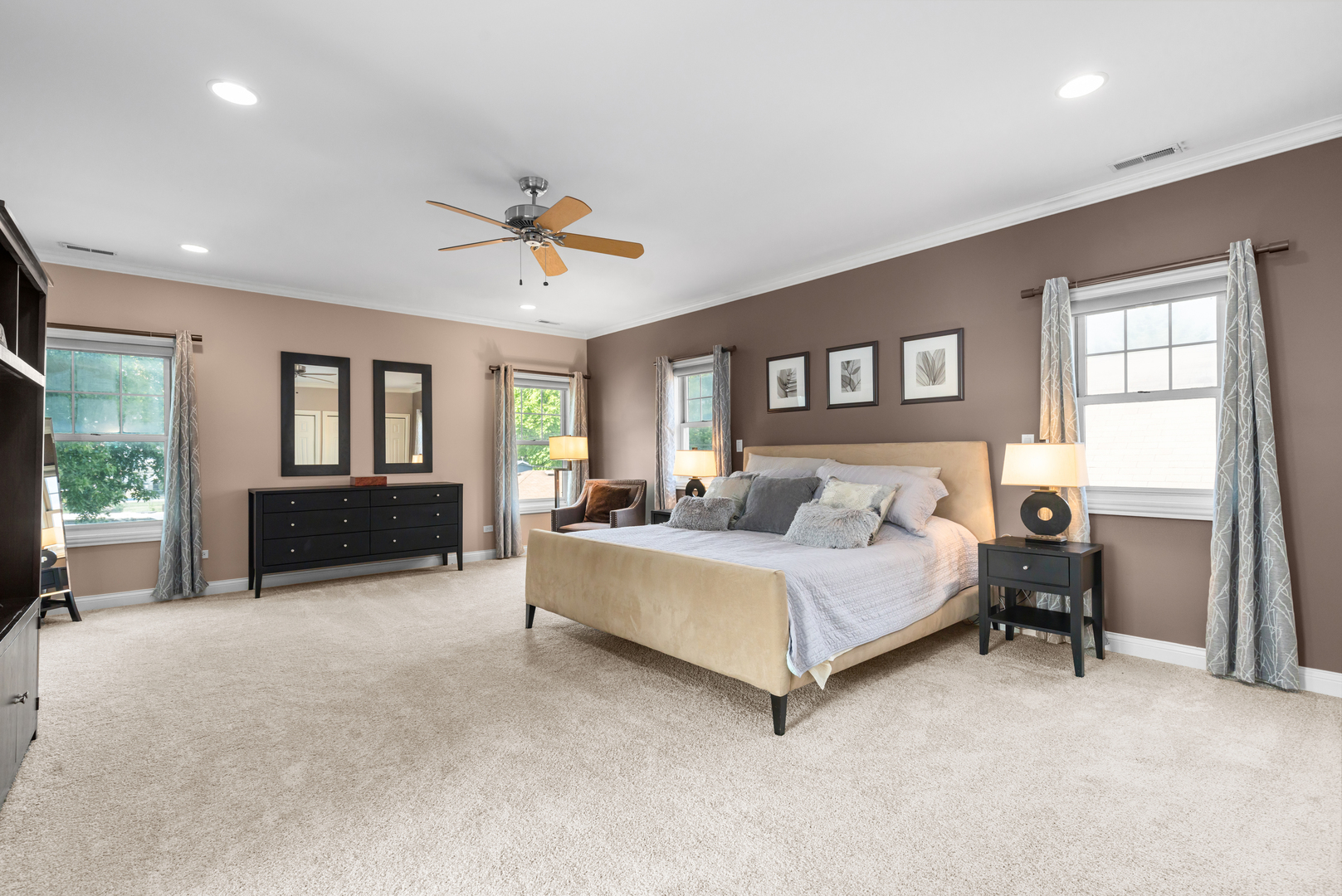 6972 West Imlay Street Chicago, IL 60631 - Photo 17 of 42 a spacious bedroom with a bed and a chandelier