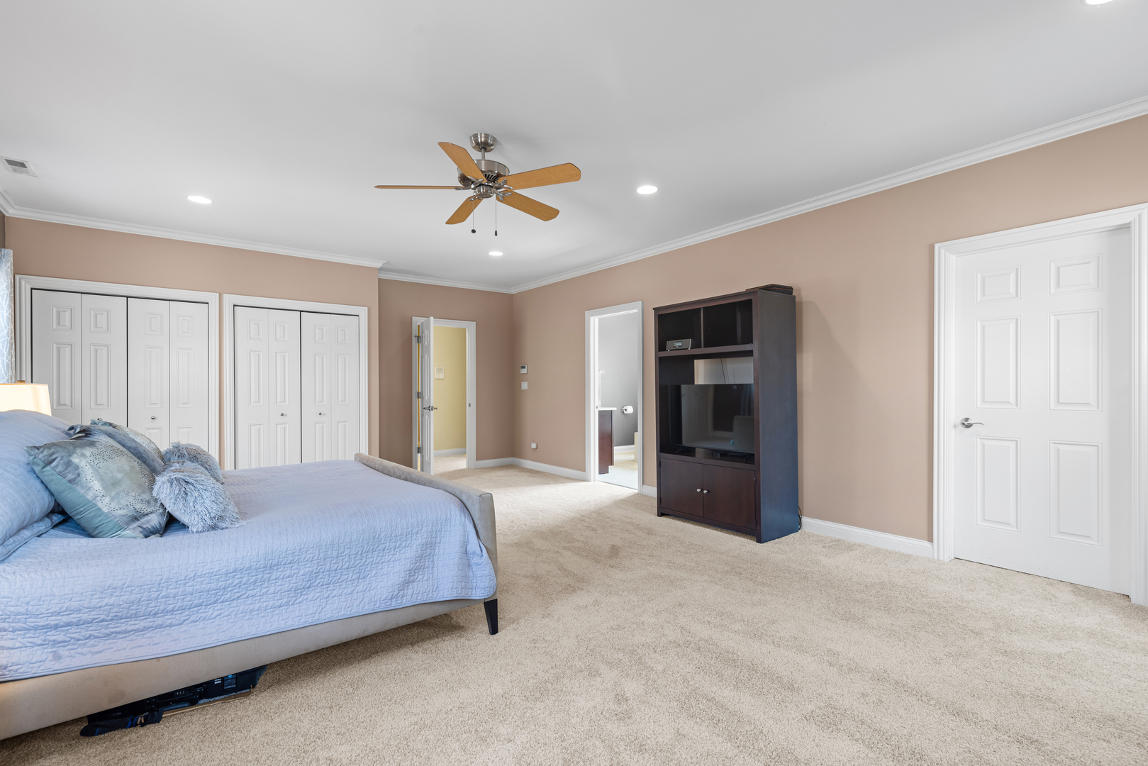 6972 West Imlay Street Chicago, IL 60631 - Photo 18 of 42 a bedroom with a large bed and ceiling fan