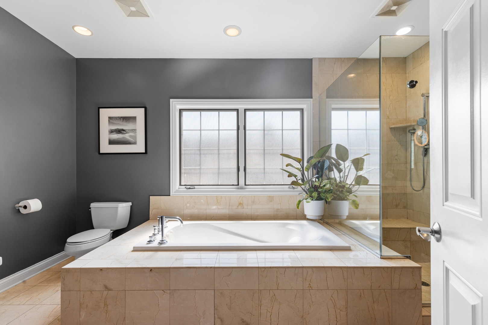 6972 West Imlay Street Chicago, IL 60631 - Photo 19 of 42 a spacious bathroom with a granite countertop tub sink and mirror