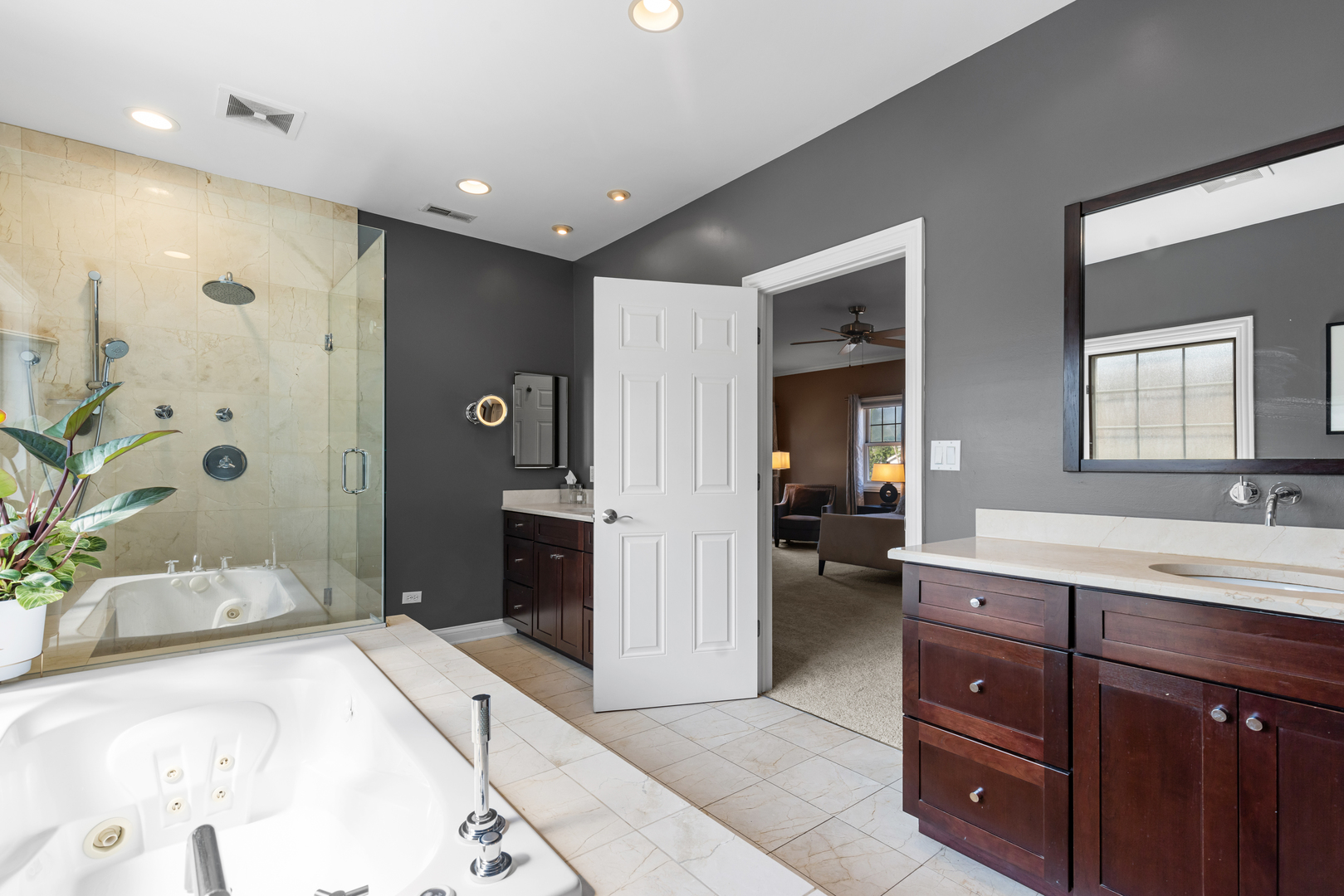 6972 West Imlay Street Chicago, IL 60631 - Photo 20 of 42 a spacious bathroom with a double vanity sink a large mirror and a shower