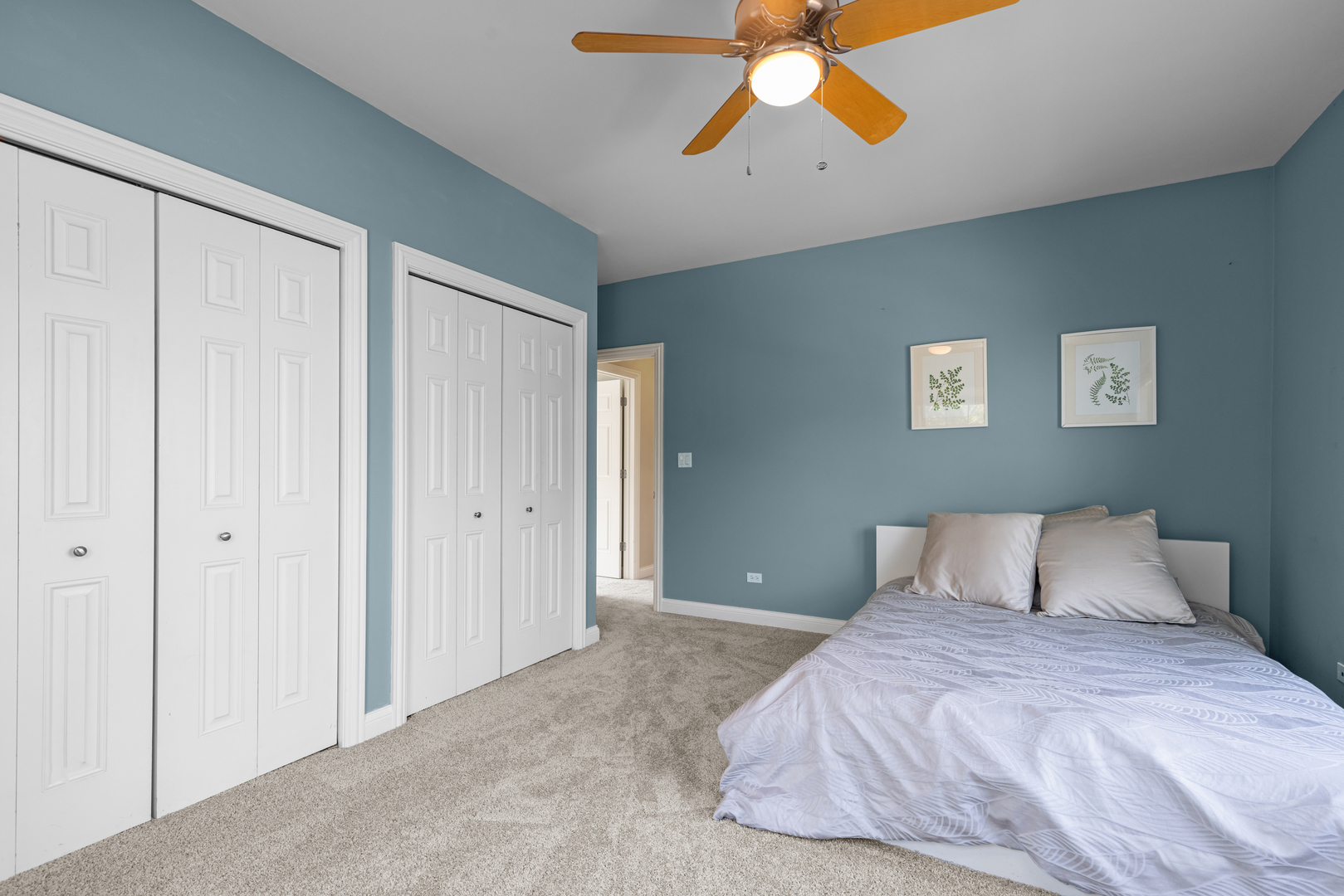 6972 West Imlay Street Chicago, IL 60631 - Photo 22 of 42 a bedroom with a bed and a chandelier