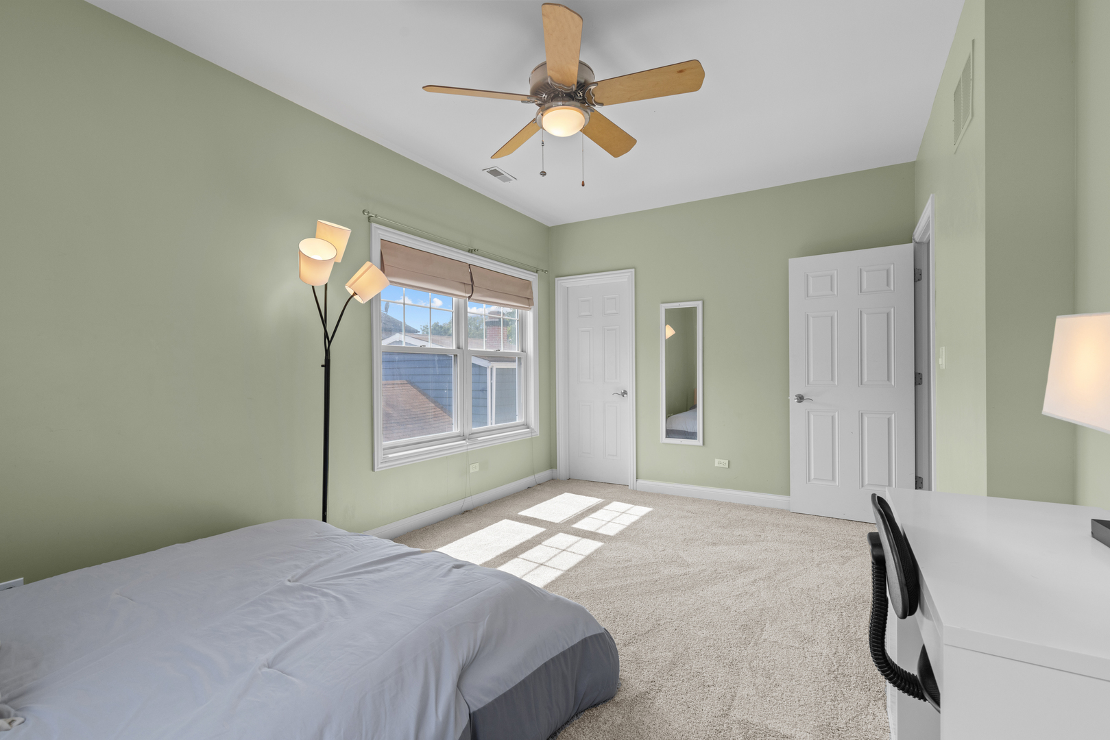 6972 West Imlay Street Chicago, IL 60631 - Photo 24 of 42 a bedroom with a bed and a chandelier