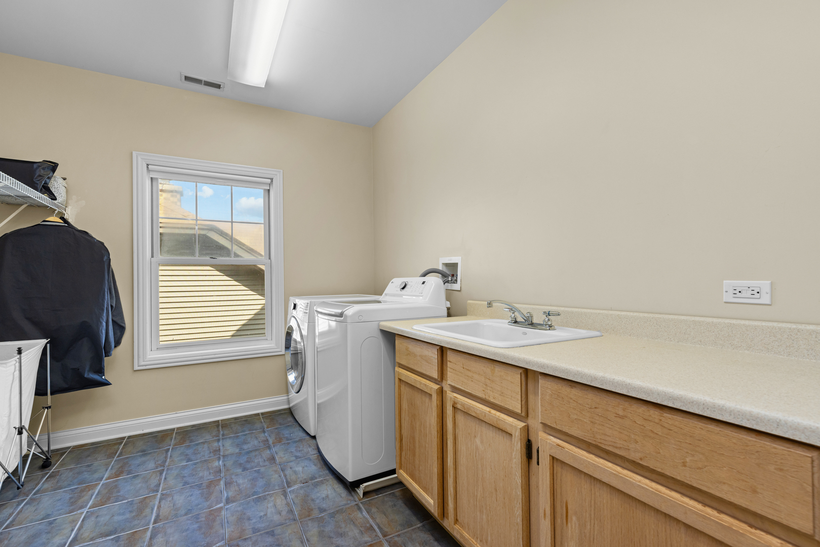 6972 West Imlay Street Chicago, IL 60631 - Photo 26 of 42 a utility room with a sink dryer and washer