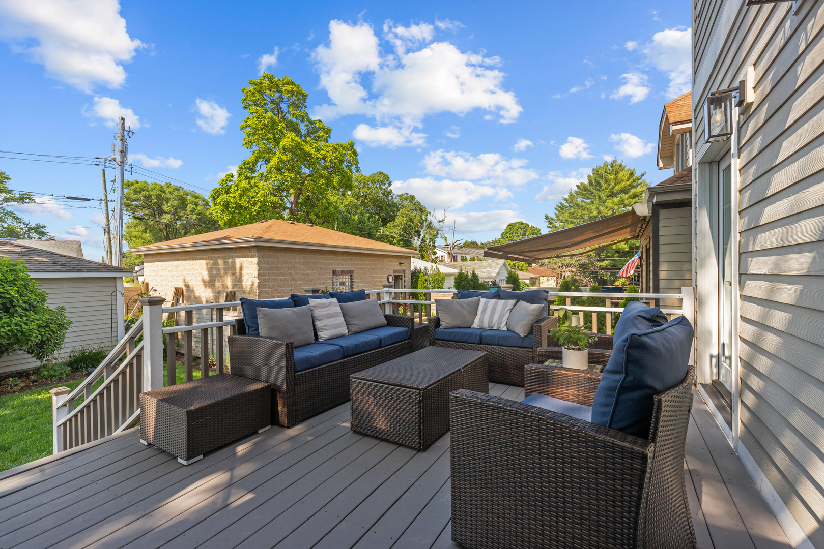 6972 West Imlay Street Chicago, IL 60631 - Photo 39 of 42 a view of a deck with couches with wooden floor and fence