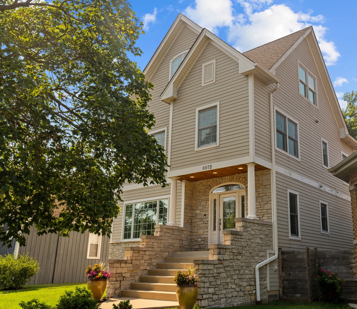 6972 West Imlay Street Chicago, IL 60631 - Photo 42 of 42 a front view of a house with a yard