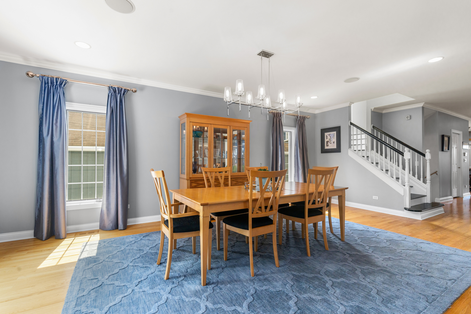 6972 West Imlay Street Chicago, IL 60631 - Photo 5 of 42 a dining room with furniture a chandelier and wooden floor