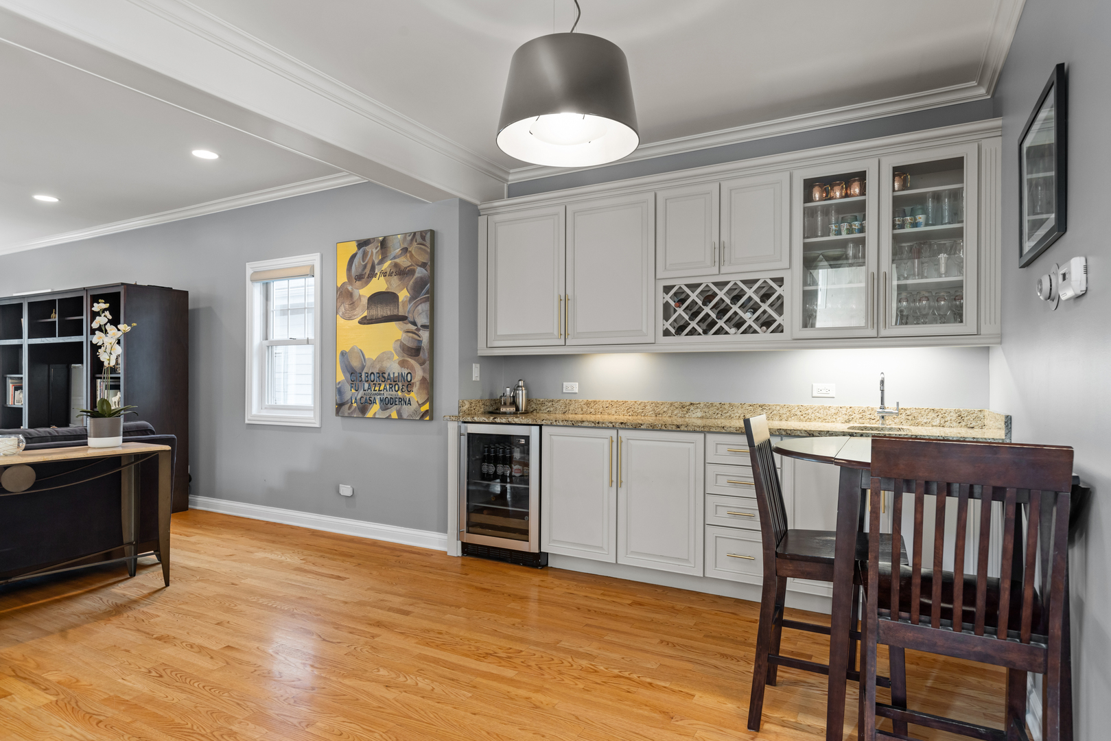 6972 West Imlay Street Chicago, IL 60631 - Photo 7 of 42 a kitchen with granite countertop a stove a sink and a dining table