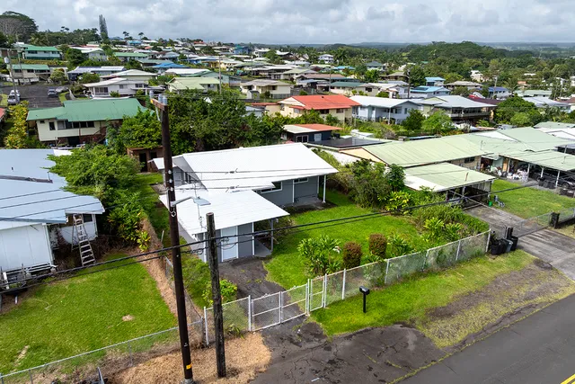 an aerial view of a house with a garden