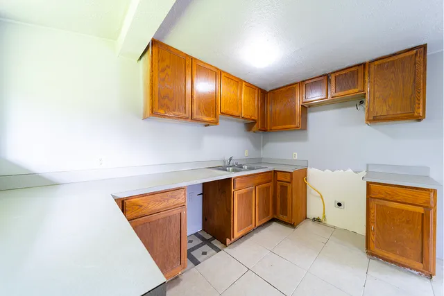 a kitchen with stainless steel appliances granite countertop a sink and cabinets