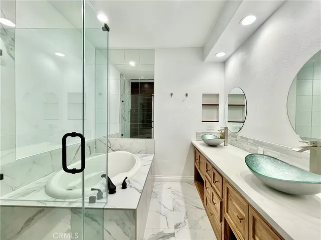 a bathroom with a double vanity sink and a mirror