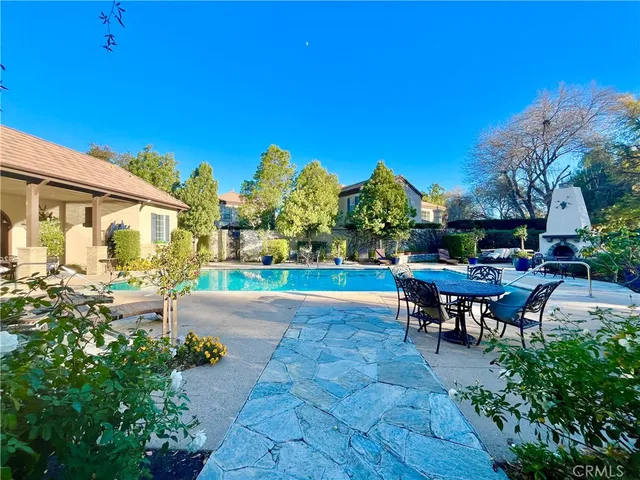 a view of a house with a yard and sitting area