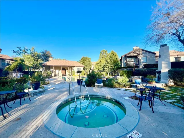 a lobby with furniture and floor to ceiling window