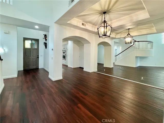 a view of a room with wooden floor
